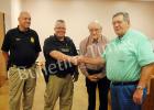 Whiteville Police Commissioner, Richard Hamilton congratulates officer Tommy Naylor for a job well done. (l-r): Steven Stanley (Whiteville Police Chief), Officer Tommy Naylor, James Bellar, (Whiteville Mayor), Richard Hamilton, (Whiteville Police Commissioner). 